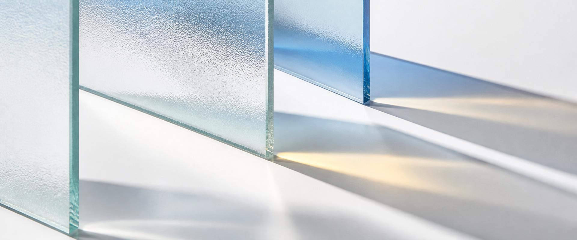 Frosted architectural glass detail with soft blue and yellow light